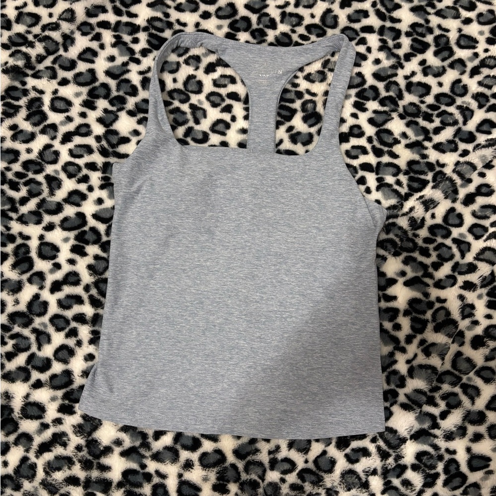 Fits like a medium, never worn.
